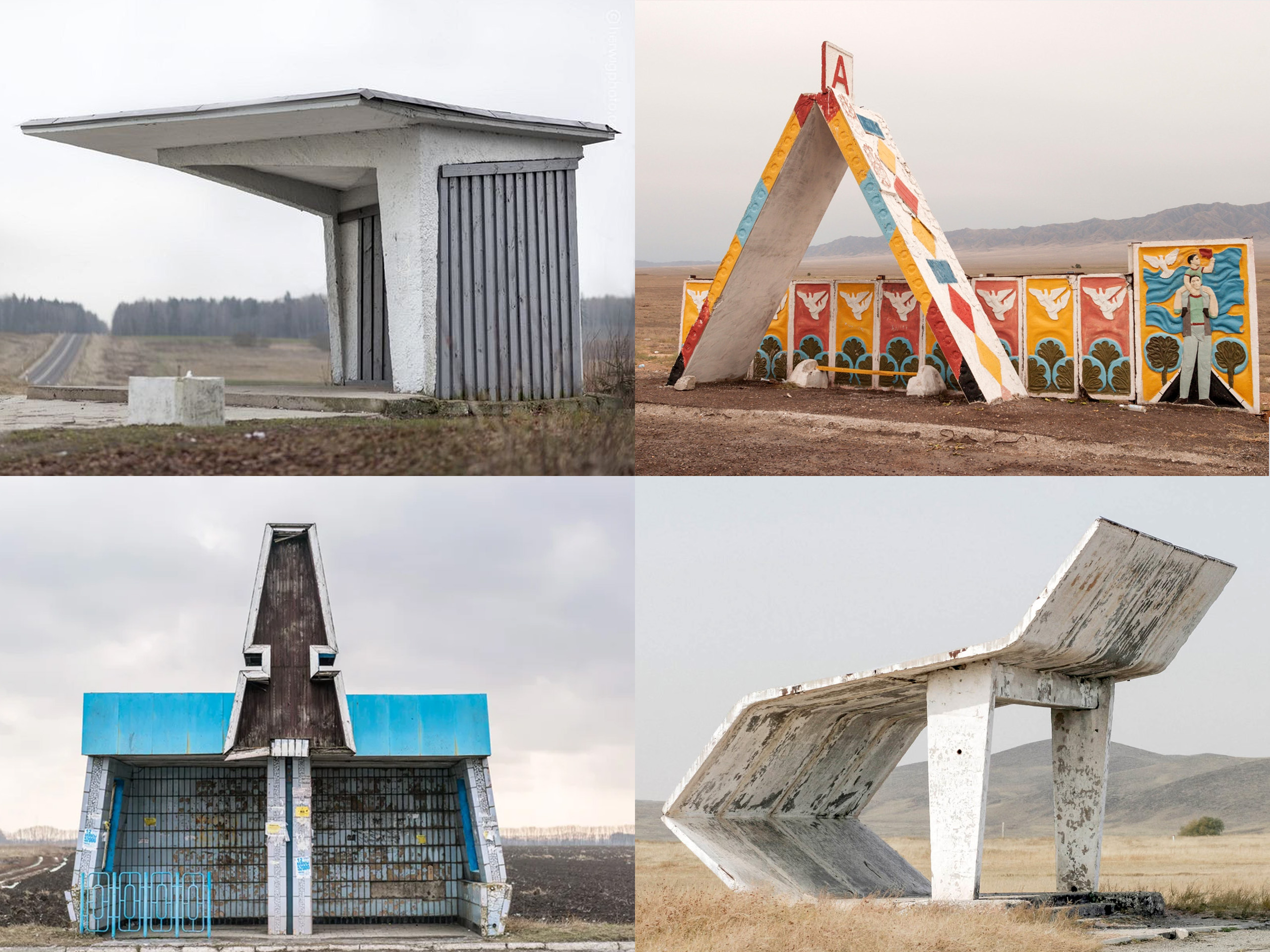 Desert roadside with a weathered concrete kiosk and a tall, colorful A-frame sculpture beside murals on a long wall.