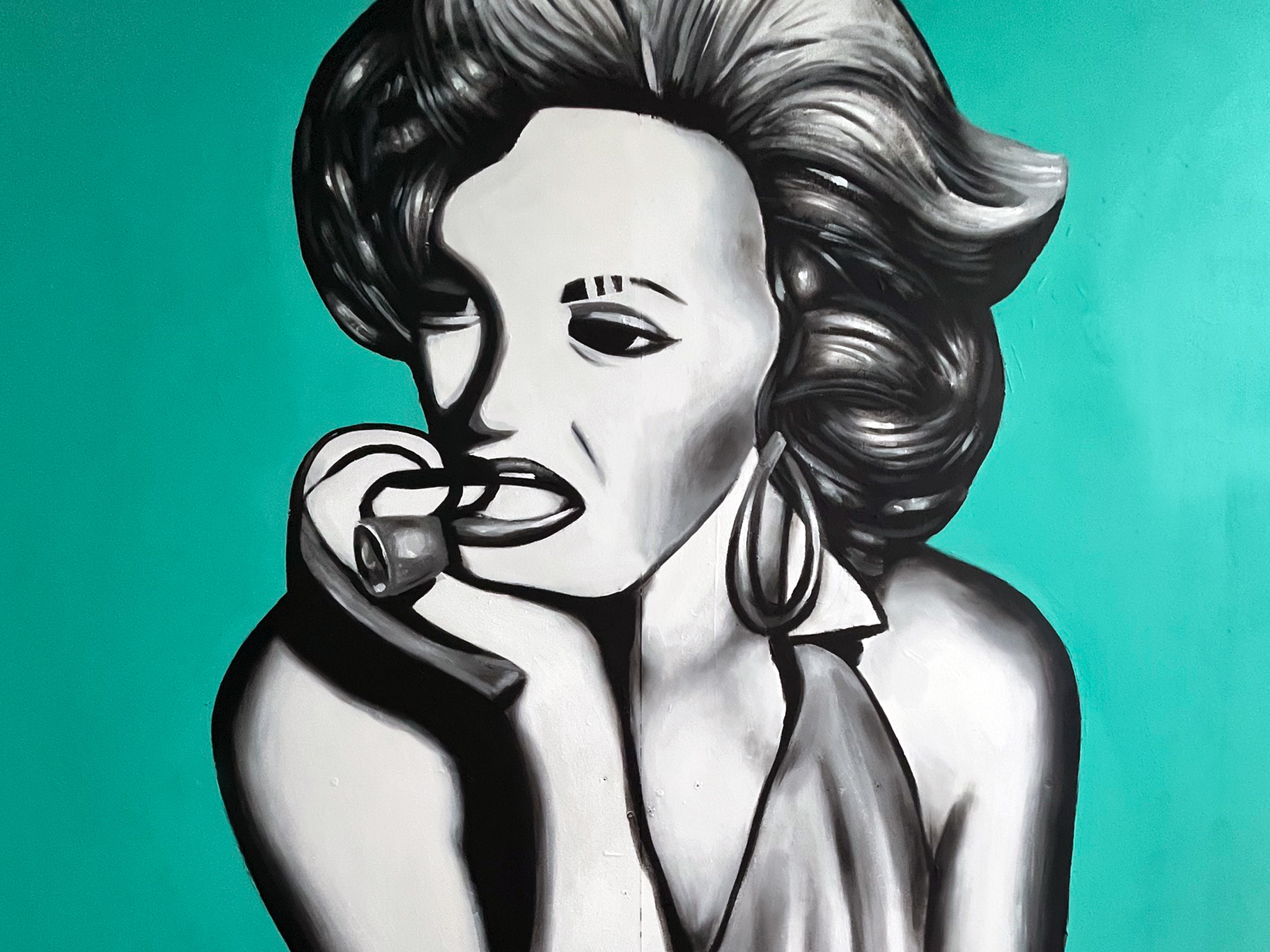 Stylized black-and-white portrait of a retro-style woman with a cigarette against a teal mural background.